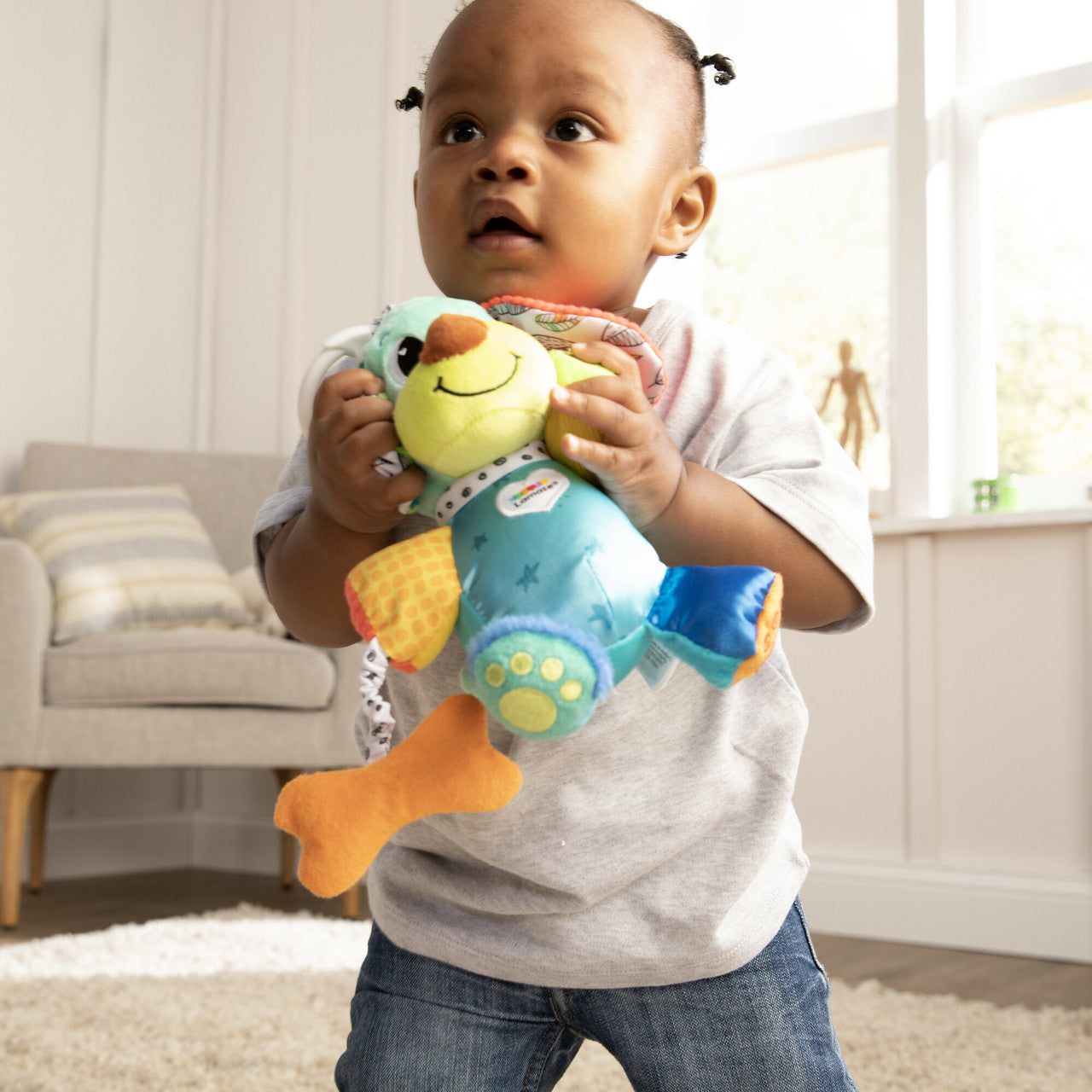 Lamaze Pupsqueak™ Clip & Go - Perrito Sensorial de Bebe