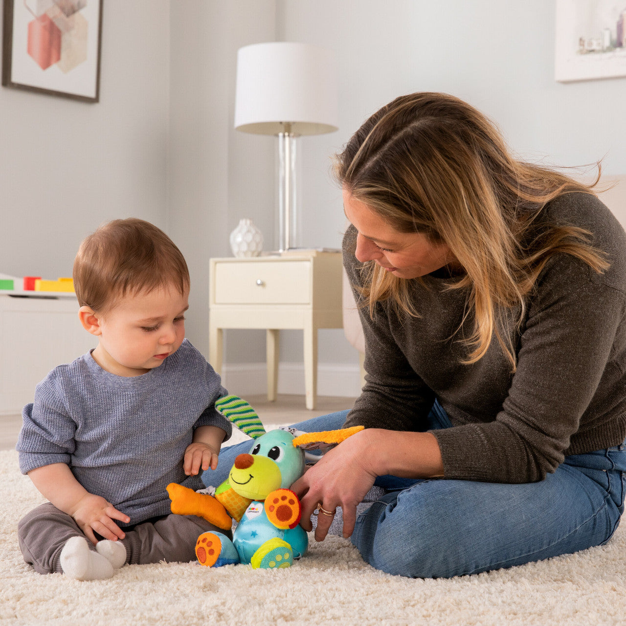 Lamaze Pupsqueak™ Clip & Go - Perrito Sensorial de Bebe